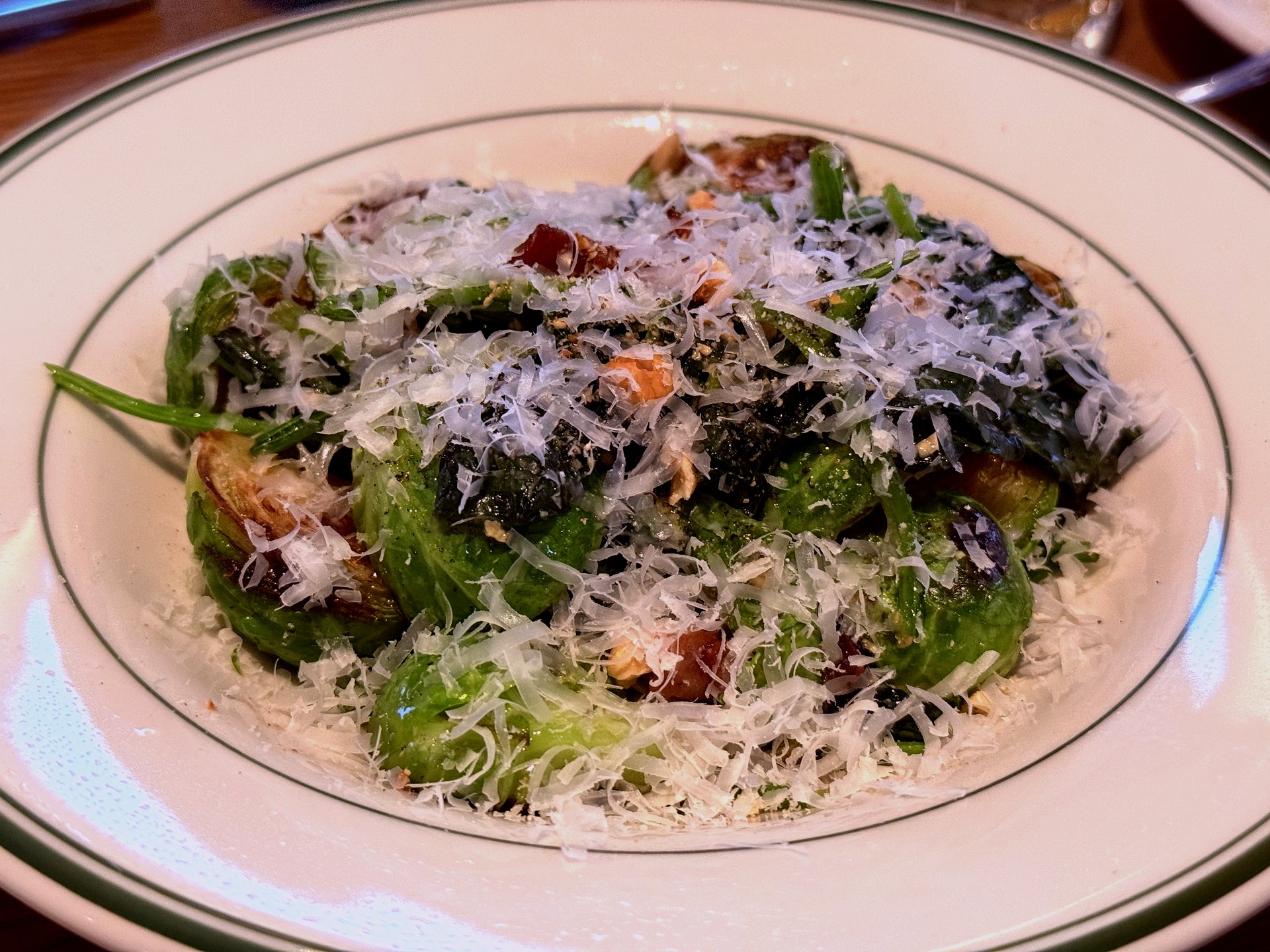 Brussels sprouts, broccolini, bacon, with grated cheese on top