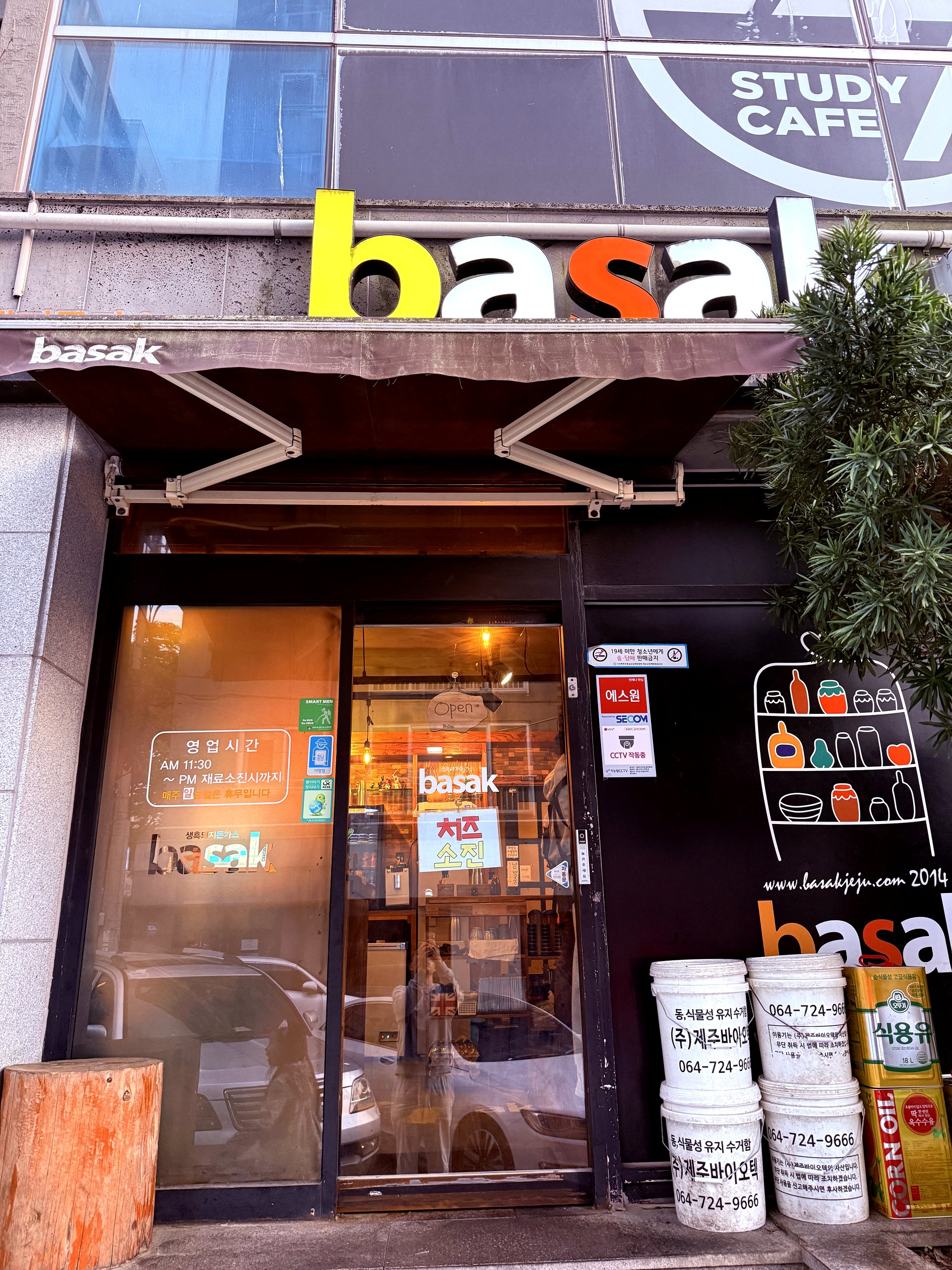 Basak Donkkaseu storefront with yellow signage in Jeju City