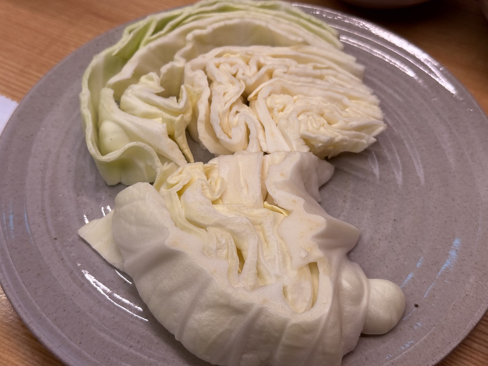 Plain blanched cabbage leaves folded on plate - the secret weapon of Daedo Sikdang