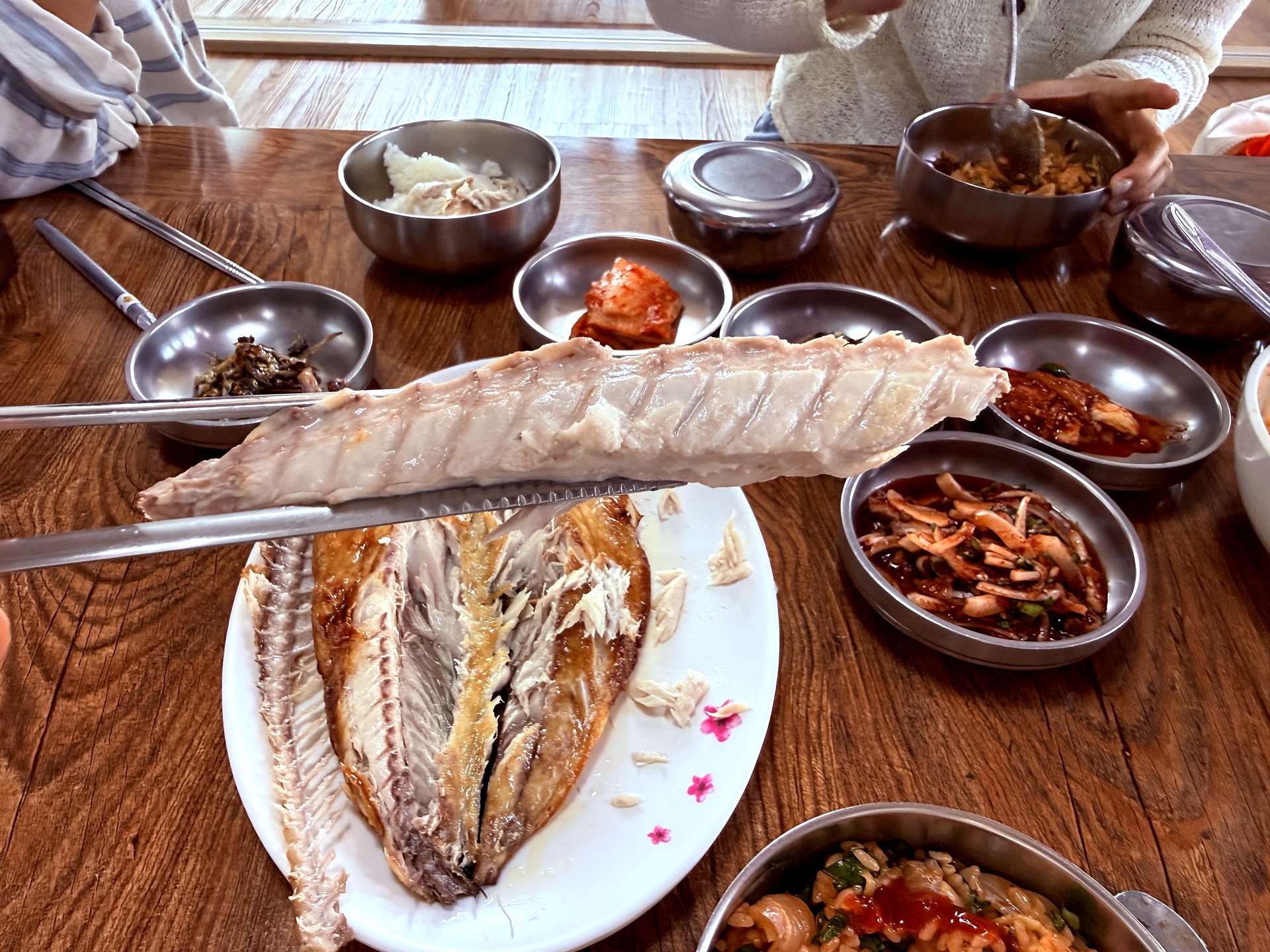 Mackerel lifted to show flesh