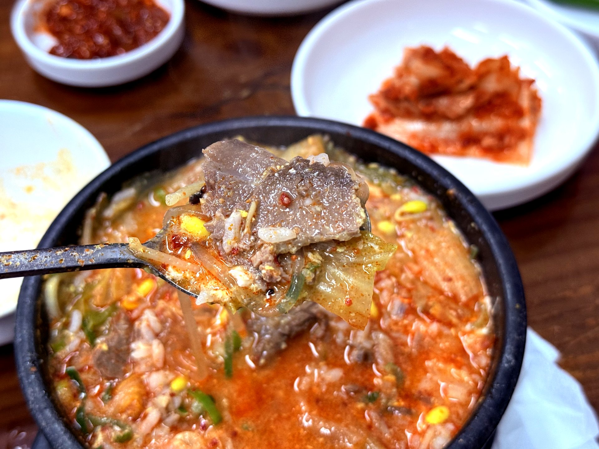 Thin-sliced Korean beef on a spoon