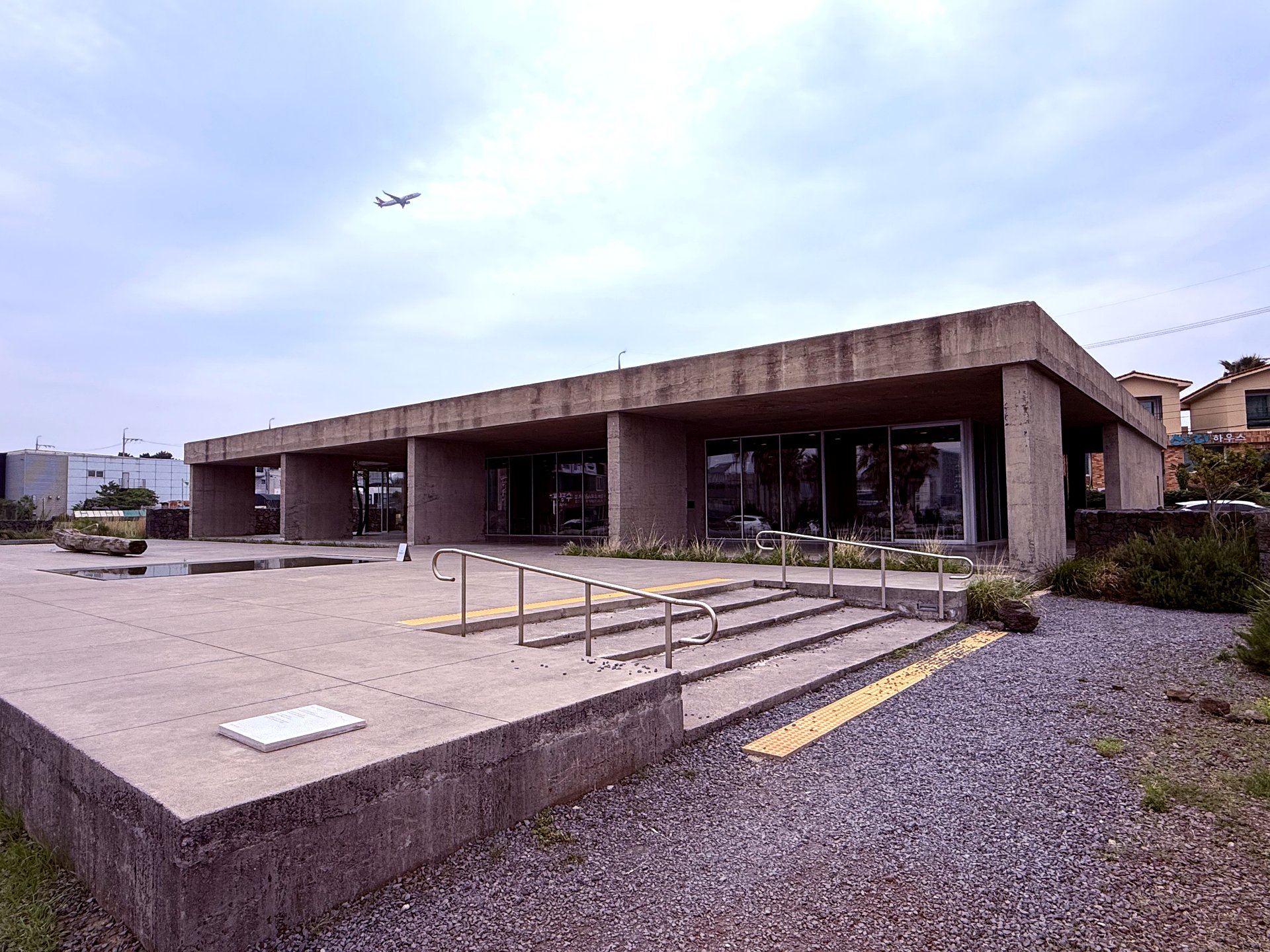 Exterior with airplane overhead