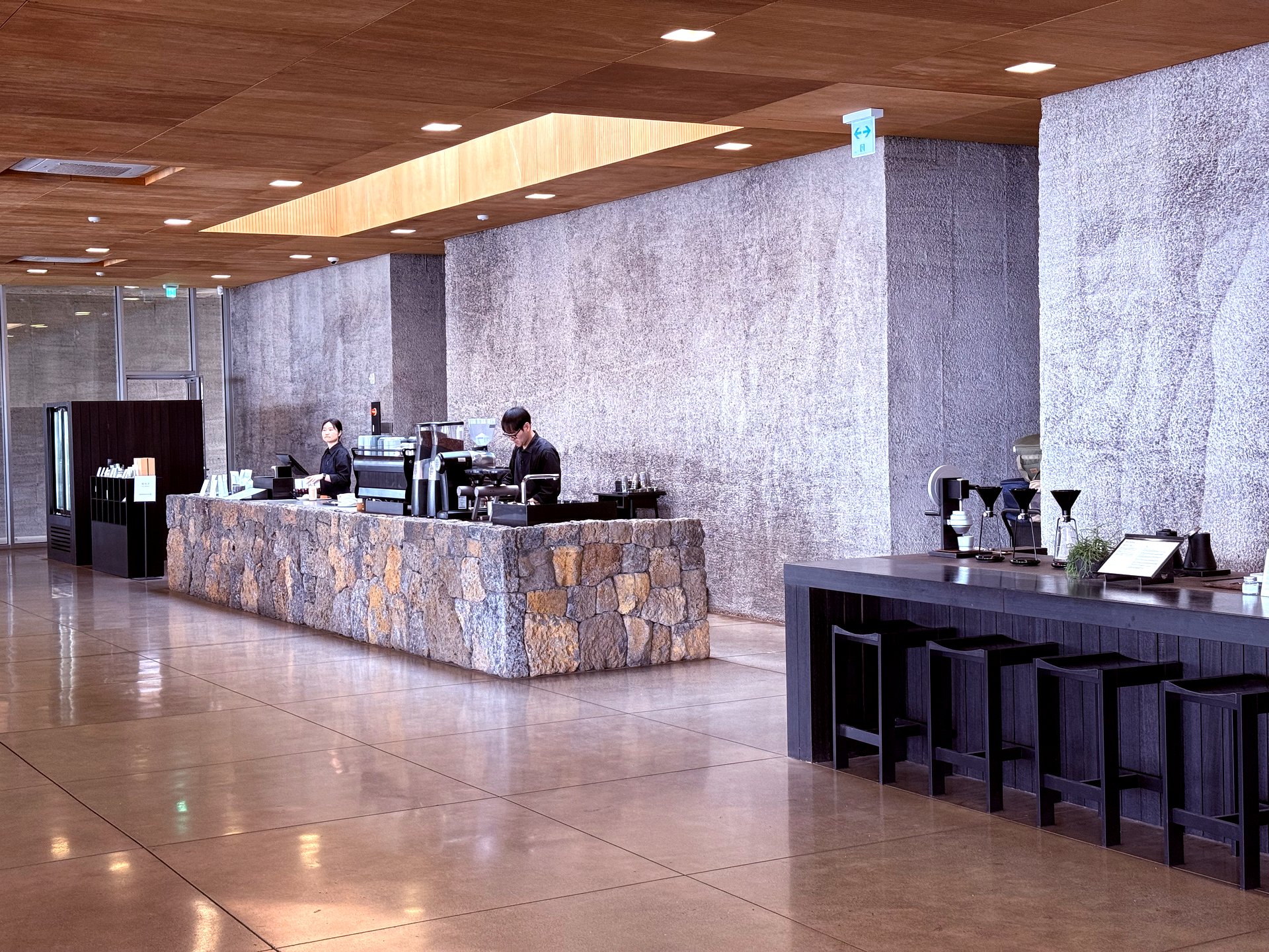 Main coffee bar built from Jeju volcanic stone