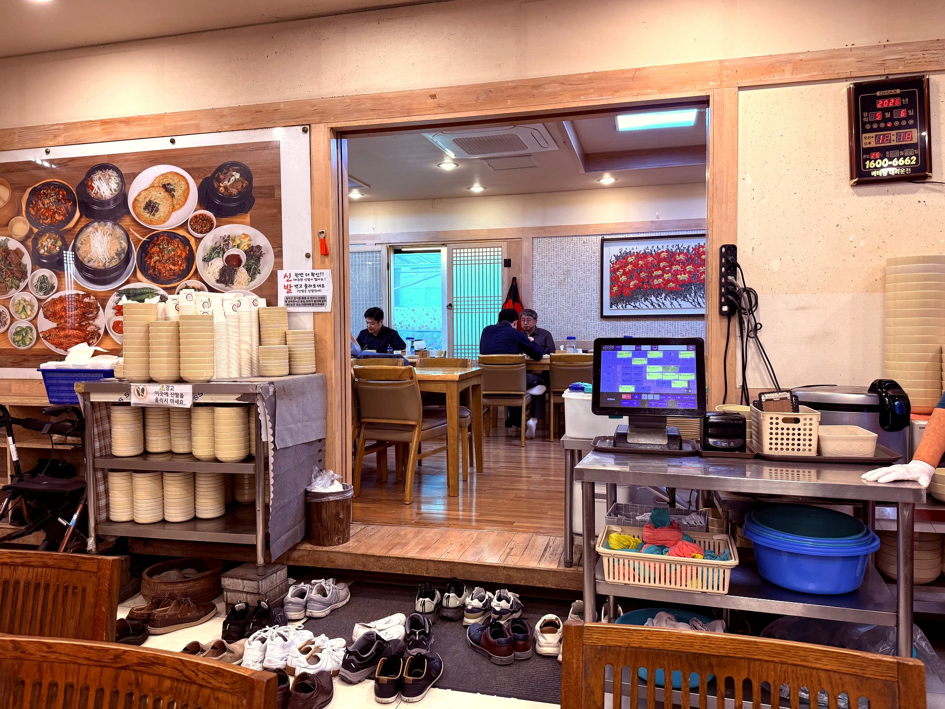 Inside the dining room with wood floors and stacked steel bowls