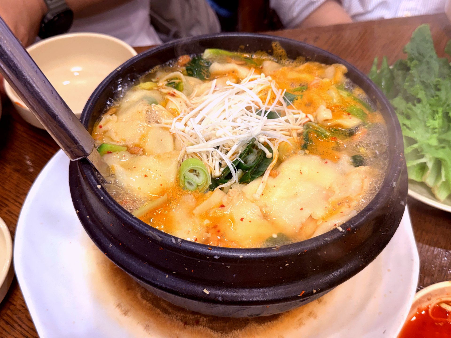 Signature Siraegi Sujebi pot - hand-torn dumplings with enoki on top