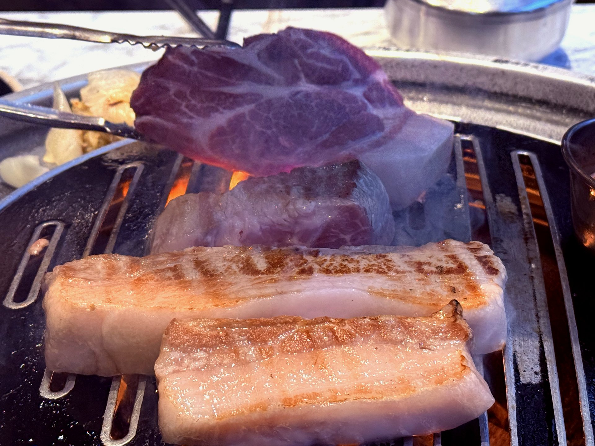 Sear close-up - thick slabs caramelizing on the grill