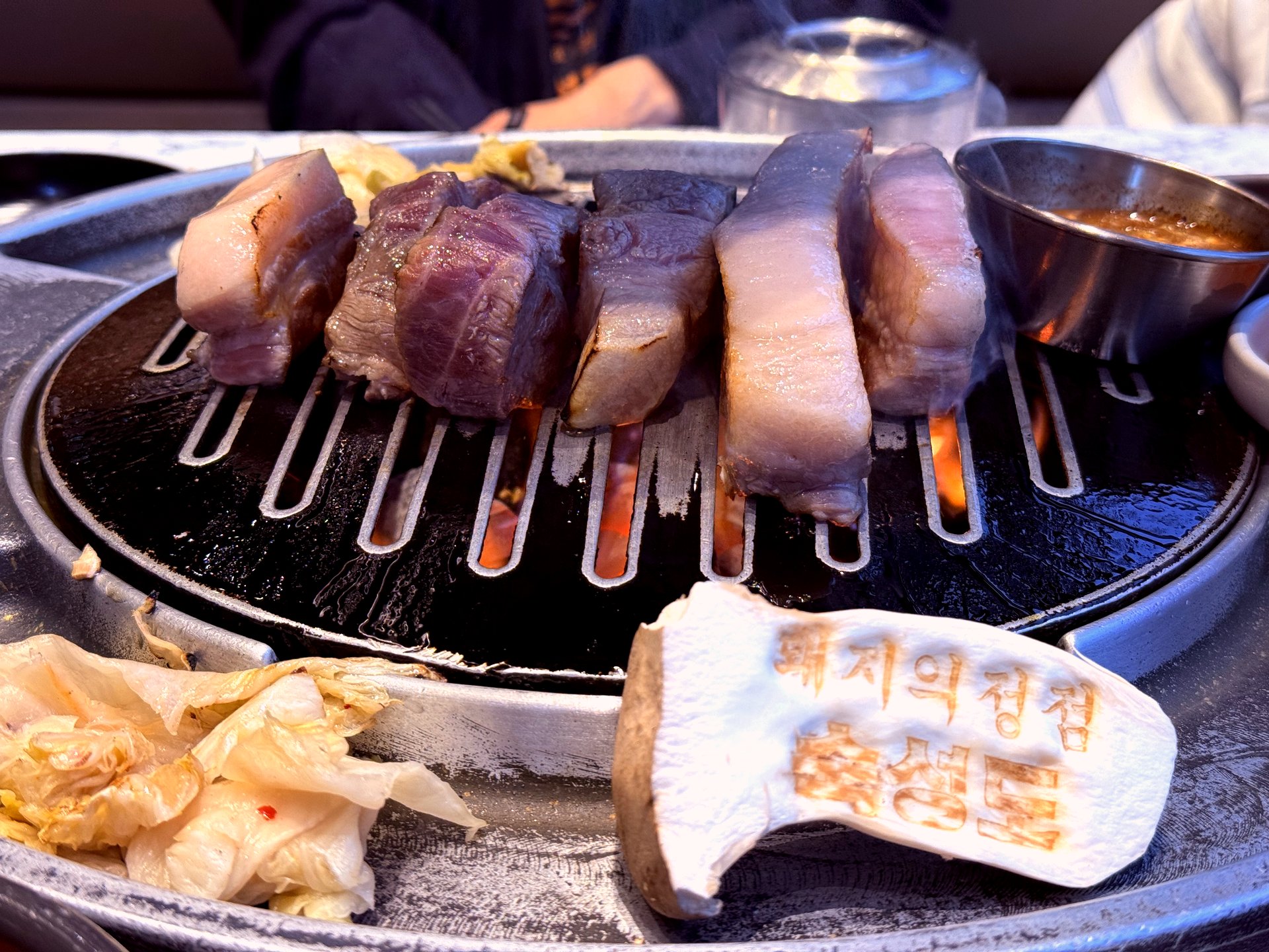 Server-cut chunks ready to eat, branded mushroom in frame
