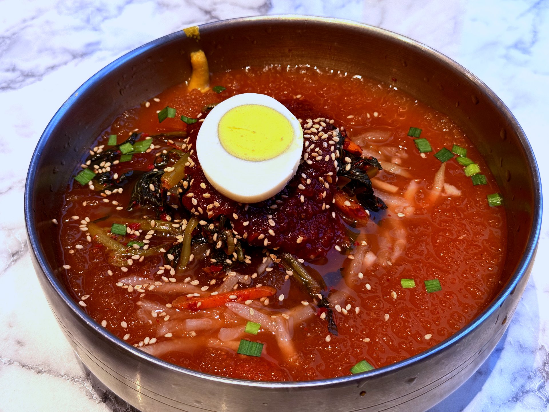 Dongchimi-guksu - cold radish-water noodles with chilled boiled egg